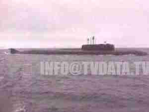 Nuclear submarine on the surface at sea, archival frame from the Kursk submariner story.