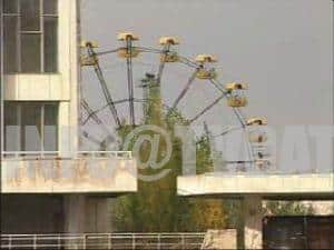 Abandoned amusement park – The iconic Ferris wheel and bumper cars, rusted and silent.