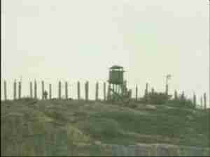 Watchtower on a ridge above the base under an overcast sky, archival frame from Kursk submarine coverage.