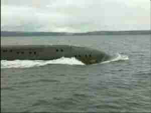 Submarine on the surface heading out to sea, archival frame from Kursk submarine coverage.