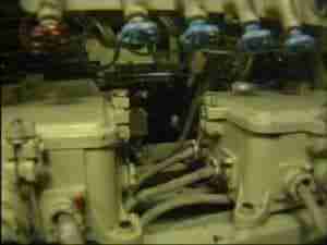 Valves and pipework inside a submarine engine compartment, archival frame from Kursk submarine coverage.