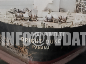 Archival 1987 news footage showing the oil tanker BRIGHT DUKE, marked “Panama,” passing through the Strait of Hormuz during a period of heightened maritime tension in the Persian Gulf. The sequence includes a close-up view of the tanker’s dark hull, the visible ship name BRIGHT DUKE, Panama registry marking, deck fittings, winches, and weathered industrial surface. This footage is suitable for documentaries, broadcast news, YouTube documentaries, energy security reports, maritime history projects, and editorial films about oil shipping, tanker convoys, the Iran–Iraq War era, the Tanker War, and strategic sea routes in the Middle East. Available for license in HD, 2K upscale, and 4K upscale. Clean footage without logo or watermark available for licensed use.